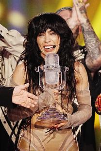 Loreen, Eurovision Song Contest winner, holding the trophy.
