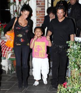 Katie Price, Peter Andre, and their son Harvey leaving a restaurant.