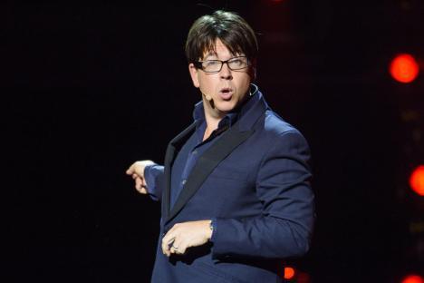 Michael McIntyre performing on stage.