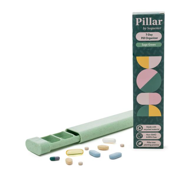 Pillar by Sequence 7-Day Pill Organizer in Sage Green, with an open organizer and various pills next to its box.