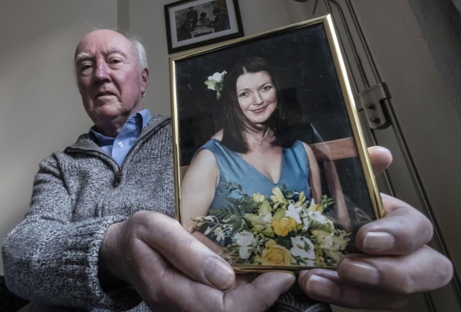 Peter Lawrence holding a framed photo of his daughter, Claudia Lawrence.