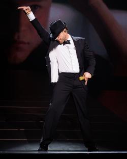 Olly Murs performing on stage.
