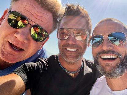 three men wearing sunglasses are posing for a picture
