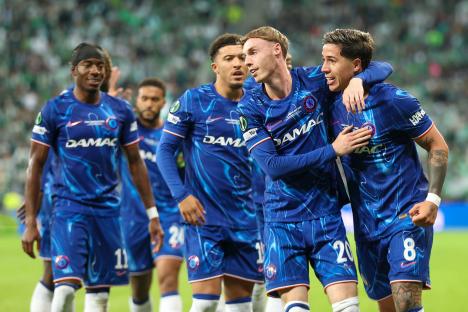 Chelsea players celebrating during a soccer match.