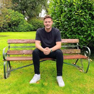 Man sitting on a park bench.
