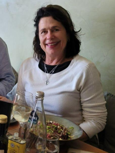 Photo of Karen Carter, a 69-year-old woman, sitting at a table.