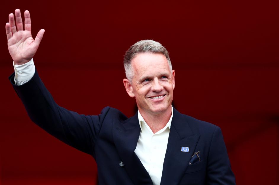 Luke Donald, Captain of Team Europe, waving to the crowd during the Opening Ceremony of the 2025 Ryder Cup.