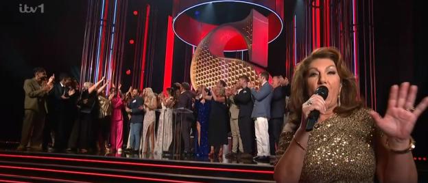 The EastEnders cast accepting the Best British Soap award.