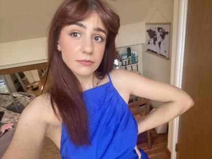 Woman in blue dress near Wimbledon.