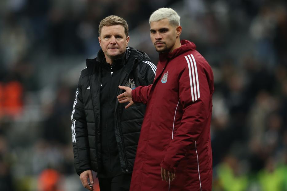 Eddie Howe and Bruno GuimarÃ£es of Newcastle United at a soccer match.