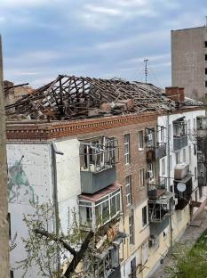 Damaged apartment building after attack.