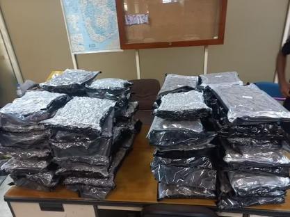 Stacks of sealed packages of confiscated drugs.