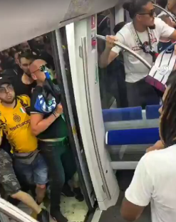 Champions League travel chaos erupts as fans block train and throw rocks and tear gas is deployed on board