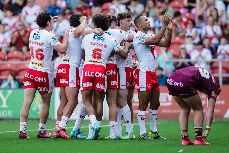 St. Helens rugby players celebrating a try.