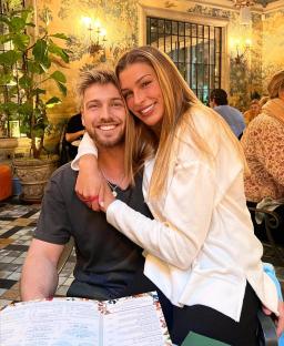Photo of a couple embracing at a restaurant.
