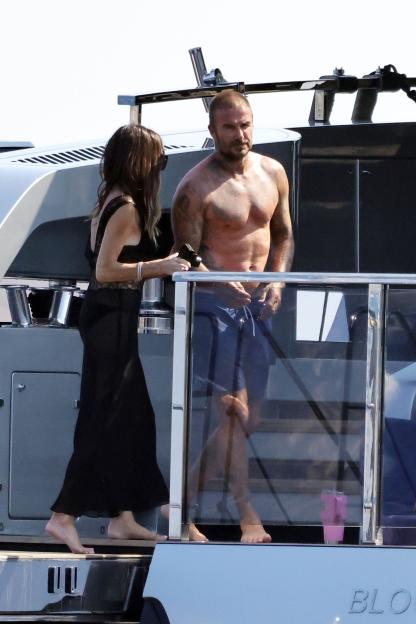 David and Victoria Beckham on a yacht.