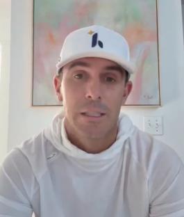 Billy Horschel in a white shirt and hat.