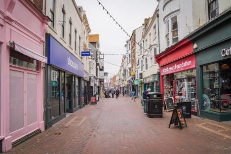 Weymouth street scene with shops and pedestrians.