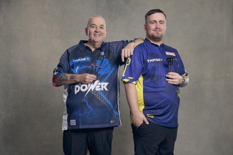 Phil Taylor and Luke Littler, two dart players, posing together.