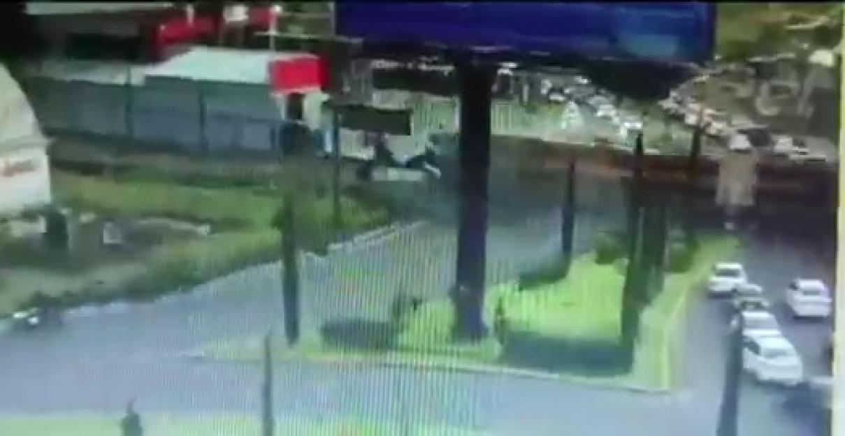 Security camera footage of a train hitting a bus.