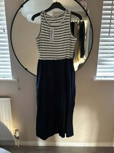 Striped midi dress on a hanger.