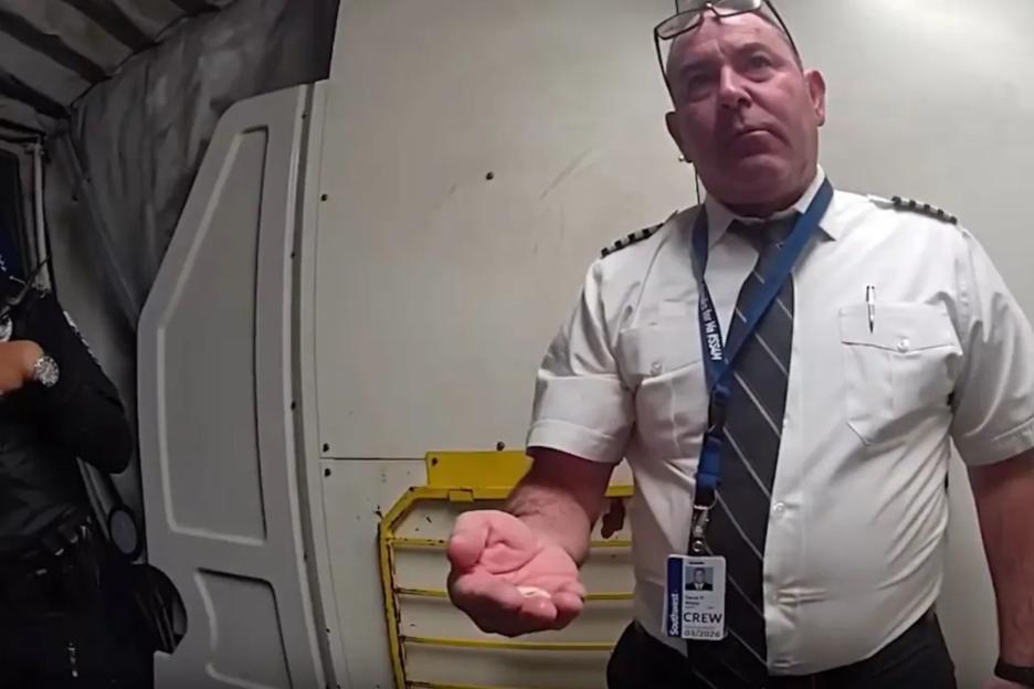 Shock moment ‘drunk’ pilot who ‘reeked of boozed’ is escorted by cops from cockpit moments before takeoff