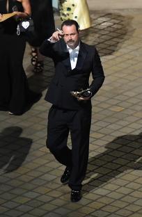 Danny Dyer leaving the BAFTA TV Awards 2025, holding an award and smoking a cigarette.