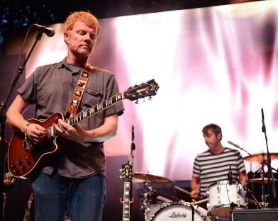 Carl Newman of The New Pornographers performing at a music festival.