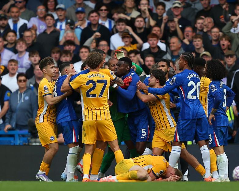 Players from Brighton & Hove Albion and Chelsea in a scuffle during a Premier League game.