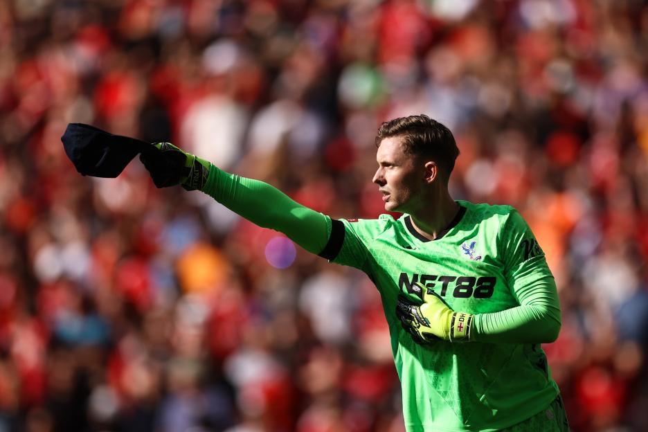 Dean Henderson, Crystal Palace goalkeeper, celebrates a penalty save.