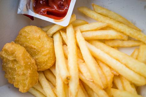 Chicken nuggets, french fries, and ketchup.
