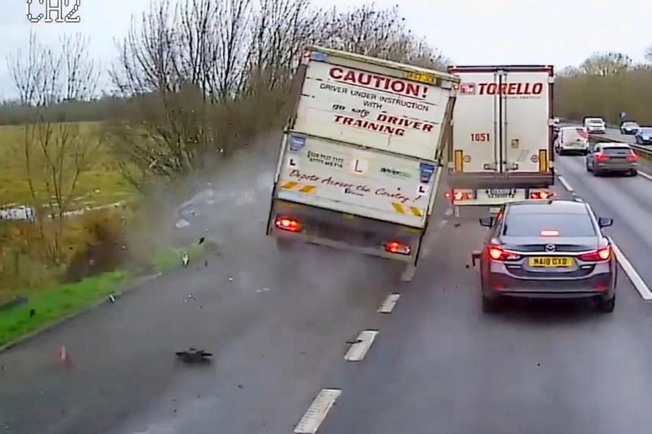 Dashcam footage of a lorry colliding with cars in a layby.