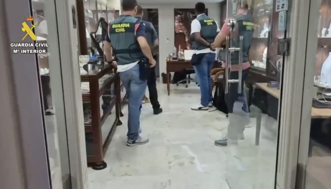 Police raid on a jewelry shop.