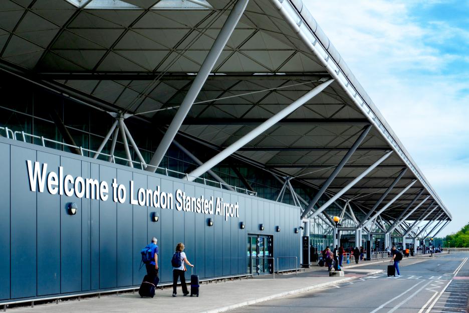 Stansted Airport partly evacuated after fire in lounge as departures suspended and huge delays through security