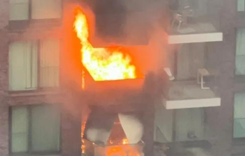 Huge fire erupts at London tower block with two flats engulfed in flames as 100 firefighters scrambled