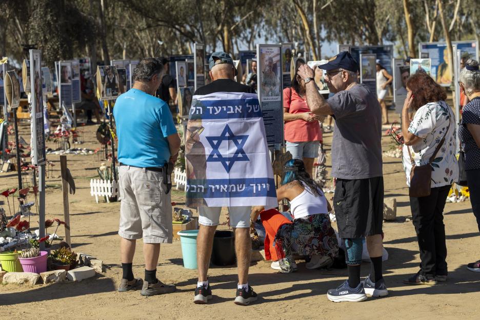 Families take part in a vigil at the Nova Festival massacre site in Israel.
