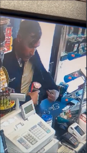Security camera footage of a man stealing a Poppy Appeal charity box.