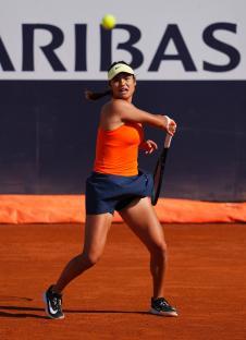 Emma Raducanu playing tennis.