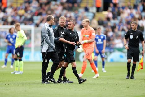 Referee receiving medical attention on the field.