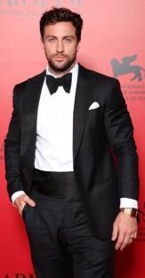 Man in tuxedo at an awards ceremony.