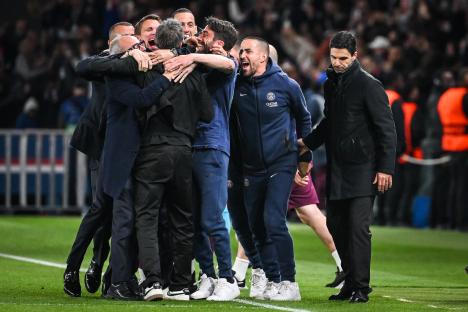 PSG staff celebrating victory with Luis Enrique and Luis Campos; Mikel Arteta looks dejected.