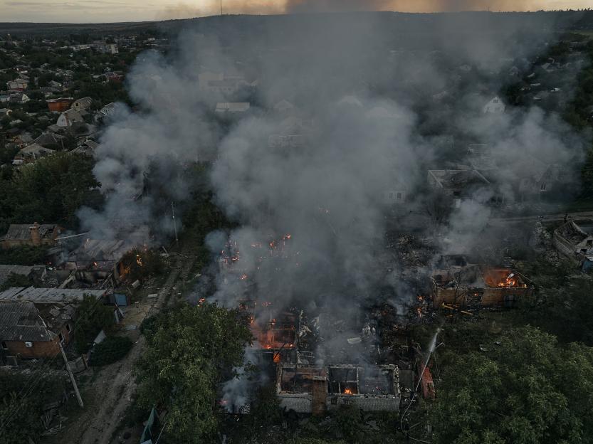 Aerial view of a residential area on fire.