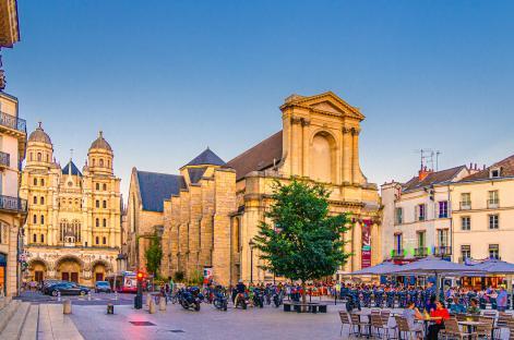 Place du Théâtre in Dijon, France, featuring the Eglise Saint-Michel and Musee Rude.