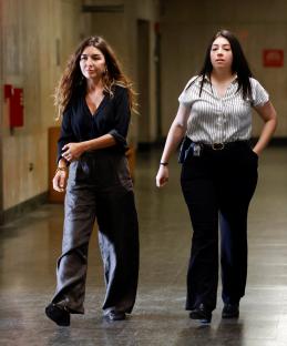 Miriam Haley, accuser in the Harvey Weinstein trial, walking in a courthouse hallway.