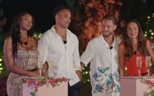 Screenshot of four people at a ceremony.