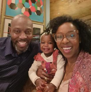 Jacqueline Shepherd, her partner David, and their child.