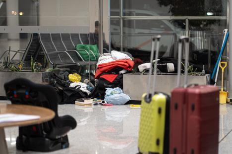 Homeless people's belongings at an airport.