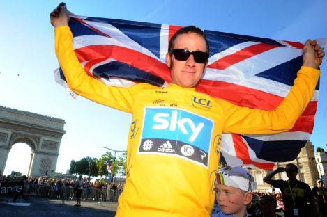 Bradley Wiggins holding a Union Jack flag after winning the Tour de France.