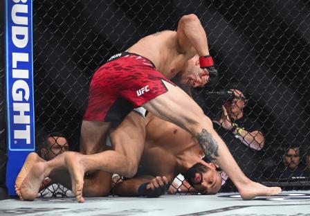 Marc-Andre Barriault landing a blow on Bruno Silva during a UFC match.
