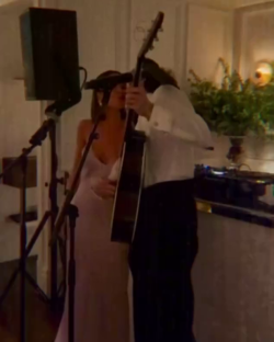 Cruz Beckham and girlfriend performing at a birthday party.
